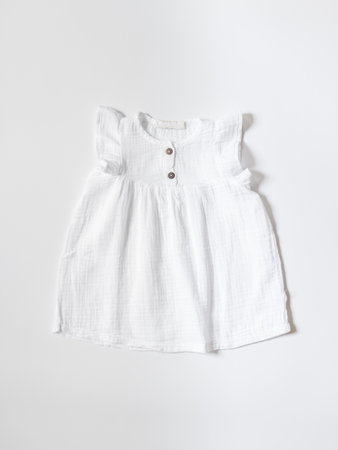 Baby cotton dress for girl flat lay. Clothing production, sewing workshop.の写真素材