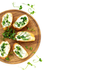 Plate of sandwiches with cream cheese and micro greens peas. Healthy food, top view.の写真素材