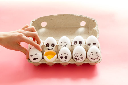 Eggs with different facial expressions. Concept of human emotions. Communication and comments on social networks.の写真素材