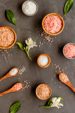 Spa treatment body care cosmetics - sea salt and scrubs in bowls, top view.の写真素材