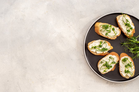 Sandwiches with fresh sprouting microgreens. Sprouted peas seeds micro greens. Vegan food.の写真素材