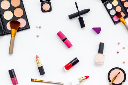 Various makeup cosmetic products - blusher, mascara, lipstick, nail polish and brushes, top view.の写真素材