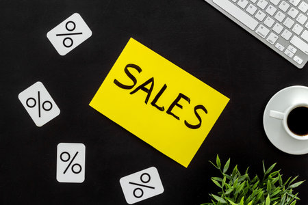 Sales concept. Online shopping - table with computer and discount sing, top view.の写真素材