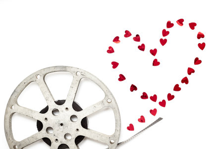 Old 35mm motion picture film reel on white background. Cinema concept.の写真素材