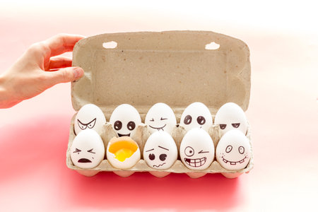 Eggs with different facial expressions. Concept of human emotions. Communication and comments on...