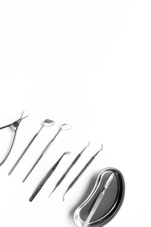 Dental equipment tools for teeth care on white background. Professional Dentist desktop, top view.