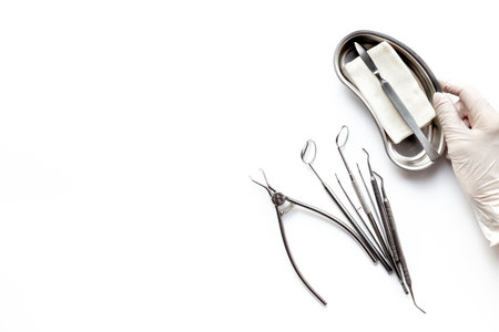 Dental equipment tools for teeth care on white background. Professional Dentist desktop, top view.の写真素材