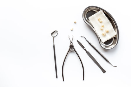 Dental equipment tools for teeth care on white background. Professional Dentist desktop, top view.の写真素材