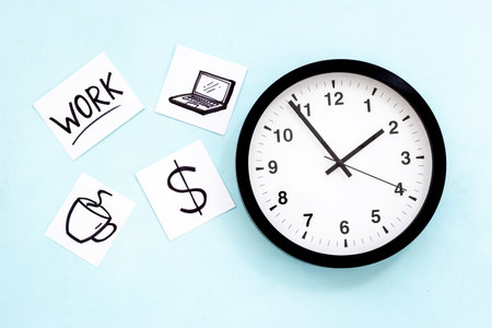 Wall clock and many paper cards with hand drawing of different life activities, top view. Time...