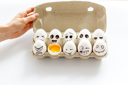 Eggs with different facial expressions. Concept of human emotions. Communication and comments on...