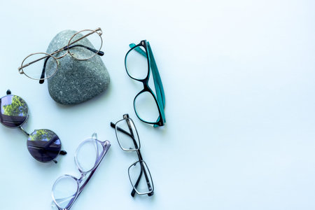 Set of stylish glasses, top view. Eye care concept.