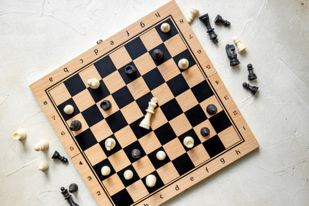 Top view of chess pieces and chessboard during the game.