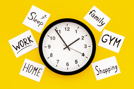 Wall clock and many paper cards with hand drawing of different life activities, top view. Time...