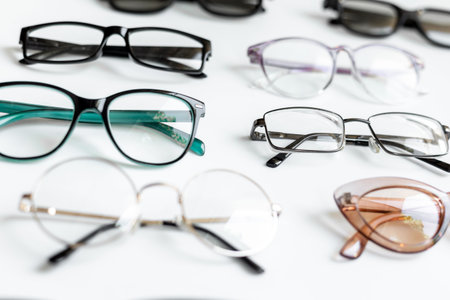 Stylish eyeglasses with lenses on white. Eye care and protection concept