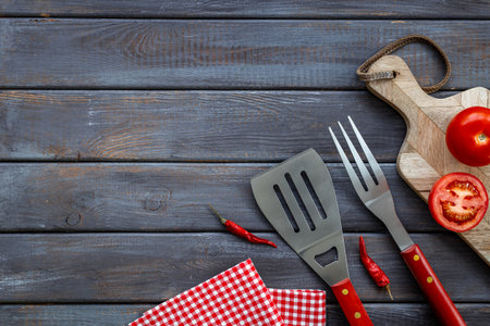 Picnic concept. Barbecue utensils and equipment with cutting board, top view.の写真素材