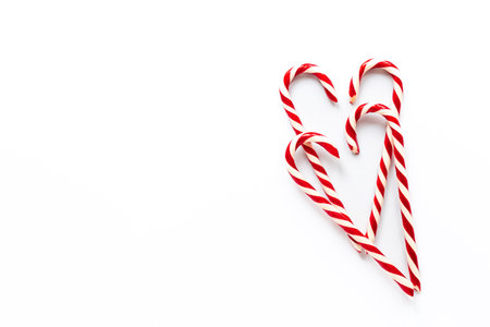 Christmas Candy Canes on white background, top view.の写真素材
