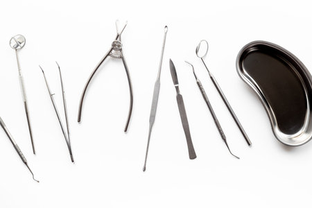 Many dental metal tools on white background. Professional Dentist desktop, top view.の写真素材