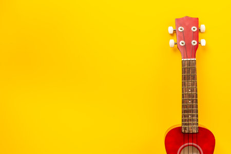 Brown four string ukulele guitar, musical instrument, cut out isolated on whiteの写真素材