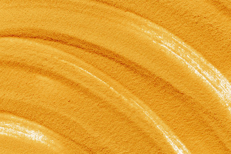 Lines and details of yellow sand texture background, close up top view. Abstract sand surface.の写真素材