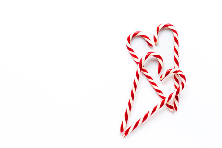 Christmas Candy Canes on white background, top view.の写真素材