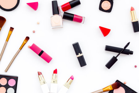 Flatlay of makeup cosmetics on white background. Blusher, mascara and lipstick, top view.の写真素材