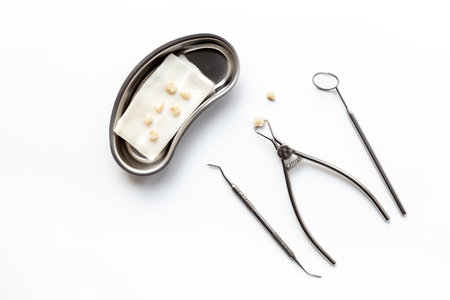 Dental equipment tools for teeth care on white background. Professional Dentist desktop, top view.の写真素材