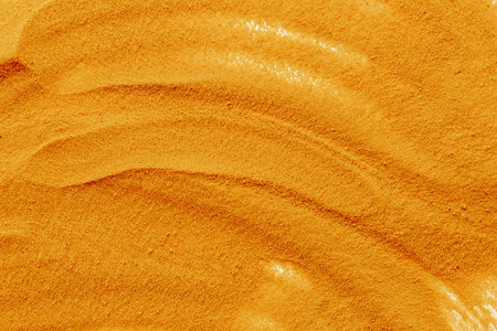 Yellow sand texture background, close up top view. Abstract sand surface.の写真素材