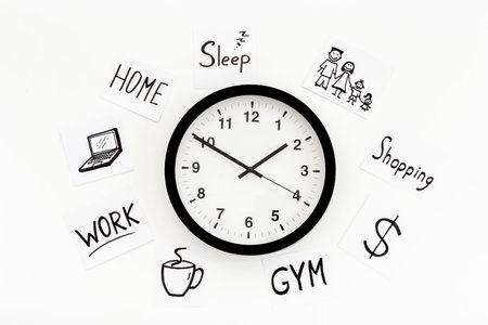 Wall clock and many paper cards with hand drawing of different life activities, top view. Time...