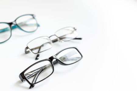 Stylish eyeglasses with lenses on white. Eye care and protection concept