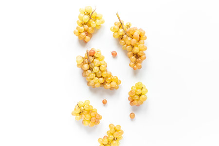 Many fresh grape clusters isolated on white backgroundの写真素材