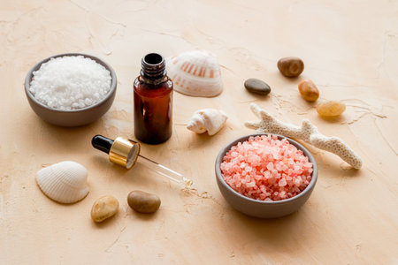 Essential oil in bottles and spa cosmetics, close up. Beauty spa therapy cosmetics and wellness background.の写真素材