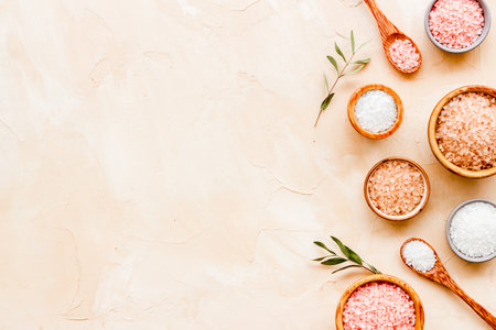 Beauty spa therapy cosmetics and wellness flat lay - sea salt in many bowls with flowers, top view.の写真素材