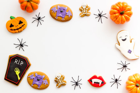 Layout of Halloween gingerbread biscuits with pumpkins, top view.の写真素材