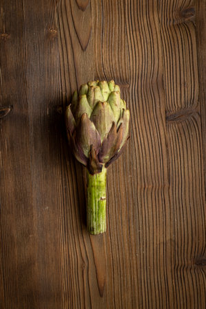 Top view of a whole heads of purple artichokes. Vegetable ready to cook.の写真素材