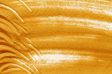 Lines and details of yellow sand texture background, close up top view. Abstract sand surface.の写真素材