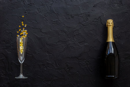 Christmas decoration flat lay with bottle of champagne, top view.の写真素材