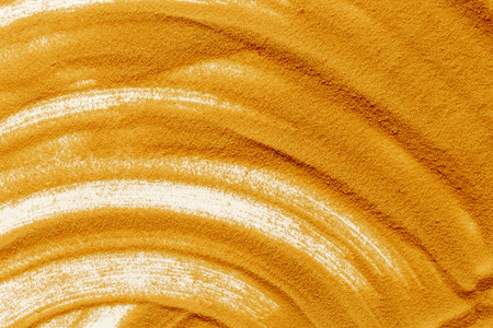 Lines and details of yellow sand texture background, close up top view. Abstract sand surface.の写真素材