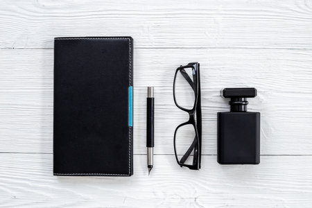 Stylish men perfume in a black bottle top view. Male fragrance and cosmetic conceptの写真素材