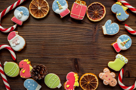 Set of different Christmas and New Year gingerbread cookies on dark wooden background, top view. Festive food concept.の写真素材
