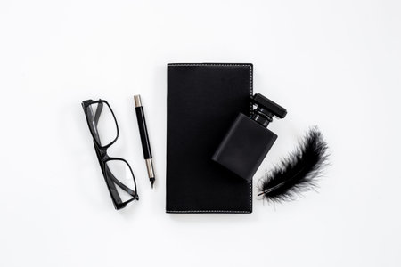 Stylish men perfume in a black bottle top view. Male fragrance concept