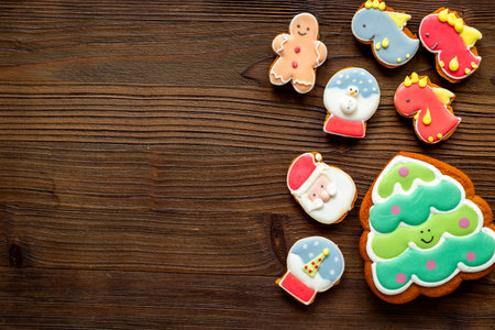 Set of different Christmas and New Year gingerbread cookies on dark wooden background, top view. Festive food concept.の写真素材