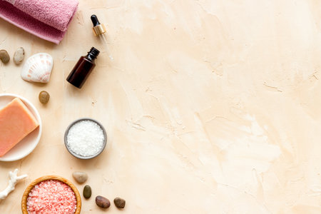Essential oil in bottles and spa cosmetics with towels, top view. Beauty spa therapy cosmetics and wellness flat layの写真素材