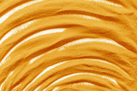 Lines and details of yellow sand texture background, close up top view. Abstract sand surfaceの写真素材