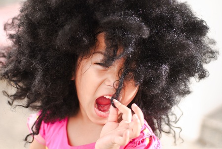 Portrait of a cute little girl in top model actionの写真素材