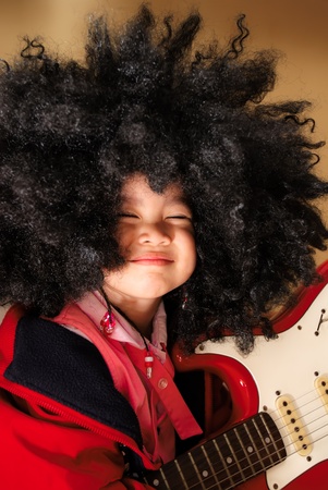 Portrait of a cute little girl musicalの写真素材