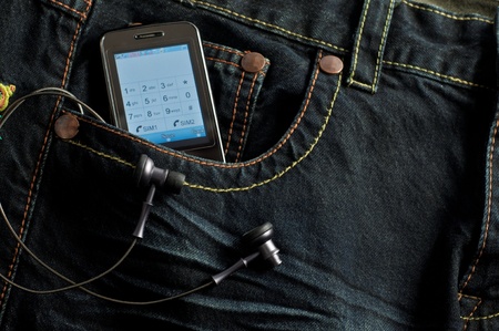 Mobile Phone  in a jeans pocket の写真素材