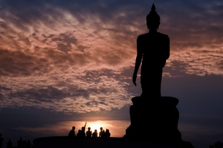 Walking Buddha image with twilight, Thailandの写真素材