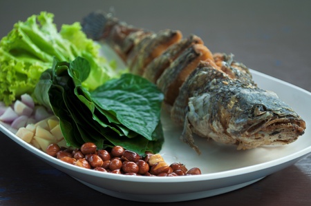 delicious thai food ,
food wrapped in leaves with fried snake fishの写真素材