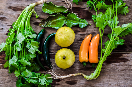 an assortment of mixed and fruits vegetables  on wooden tableの写真素材