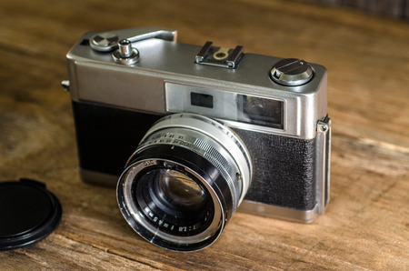 Vintage camera on wooden background.の写真素材